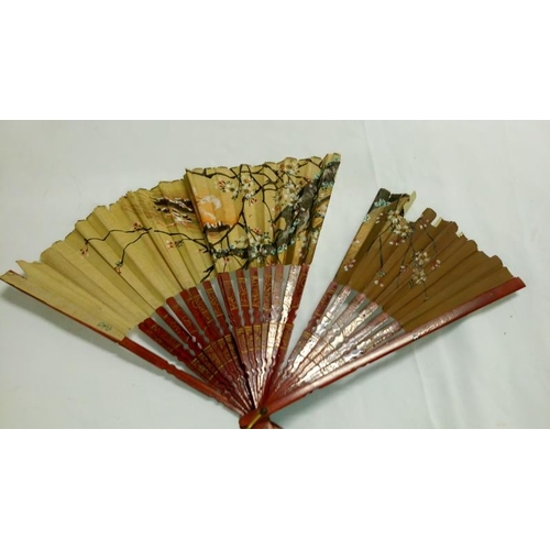 200 - A collection of mainly Chinese and hand painted fans, approximately 20