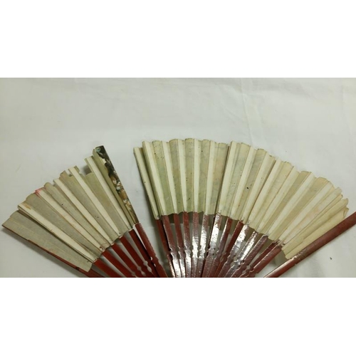 200 - A collection of mainly Chinese and hand painted fans, approximately 20