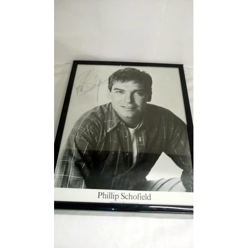 201 - A collection of celebrity photographs including signatures from Philip Schofield, Chas and Dave, Ter... 