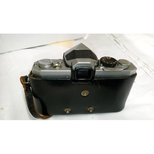 324 - A Kodak portrait brownie camera, a Petriflex camera with instruction book, a quantity of lenses, oth... 