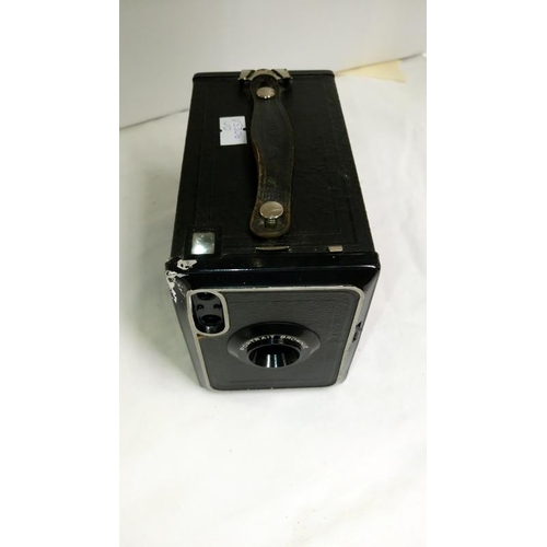 324 - A Kodak portrait brownie camera, a Petriflex camera with instruction book, a quantity of lenses, oth... 