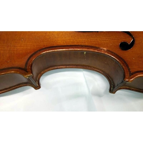 513 - A violin & 2 bows in case, label reads 'Piena student violin, model Antonius Stradivarius