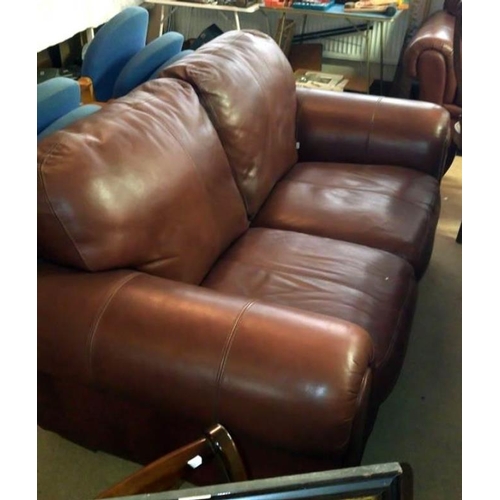 704 - A 2 seater brown leather sofa