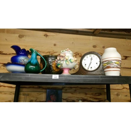 52 - A mantel clock & miscellaneous pottery