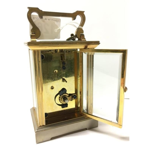 A brass carriage clock in original box marked Morrell & Hilton ...