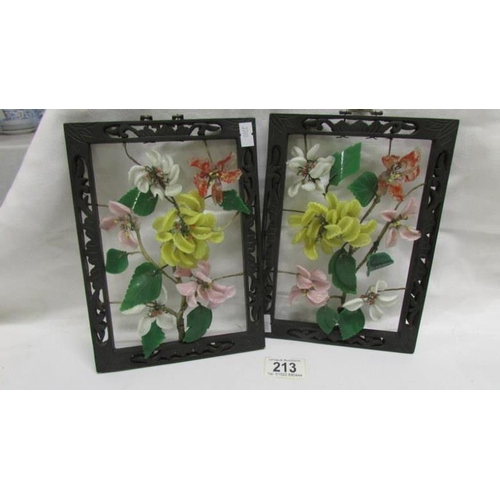 213 - A pair of Oriental floral panels