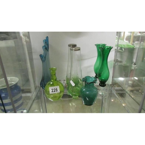 228 - A quantity of green glass vases