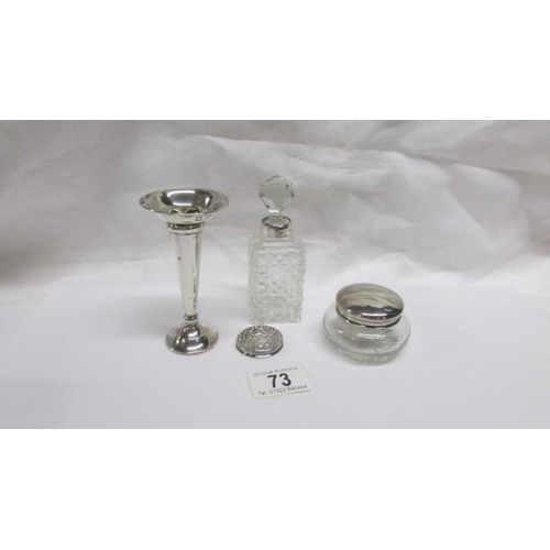 73 - A silver rimmed scent bottle, a silver topped pot and 2 other silver items