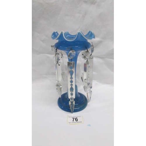 76 - A blue glass lustre vase with crystal droppers