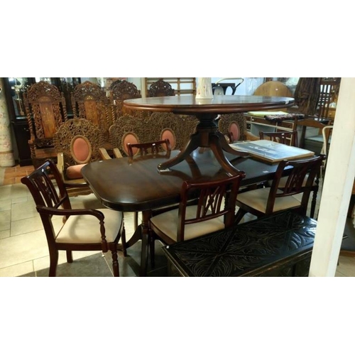 811 - A mahogany effect dining table and 4 chairs