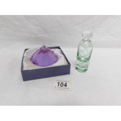 104 - A crystal paperweight and a glass scent bottle