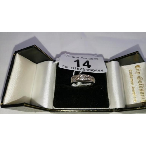 14 - An 18ct white gold ring set with double diamond band of 18 diamonds, ring size N