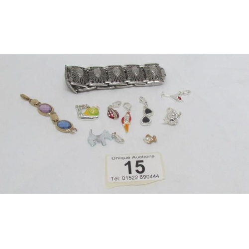 15 - A collection of seven charms including dog charm and a bracelet