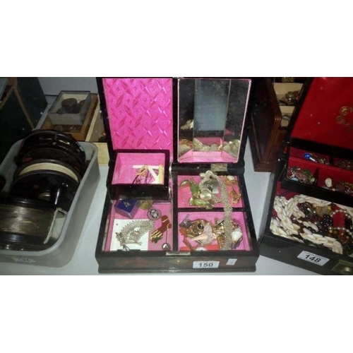 150 - A jewellery box containing assorted costume jewellery