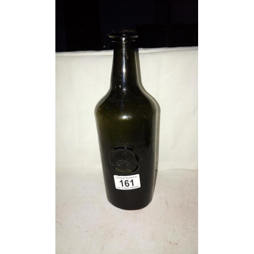 161 - An early stone glass bottle with seal of a hand and letters HC