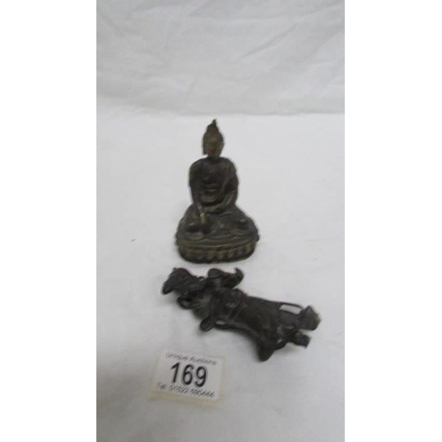 169 - A bronze Buddha and a bronze Chinese figure