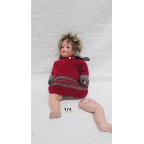 174 - A 19th century bisque headed doll with composition body marked Armande Marsielle, Germany, 990, A 30... 