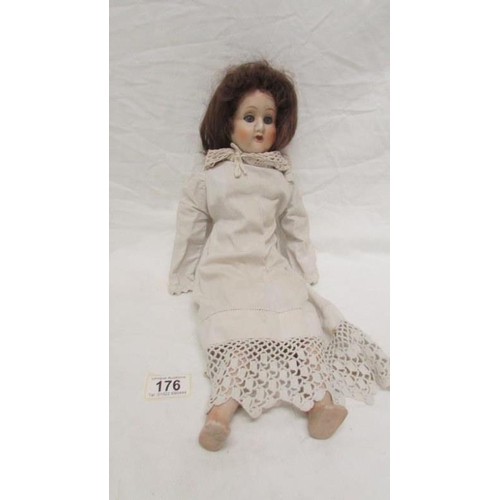 176 - A 19th century doll with composition body