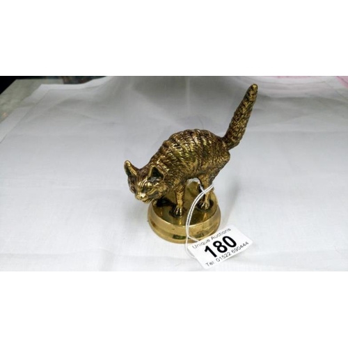 180 - A brass cat paperweight