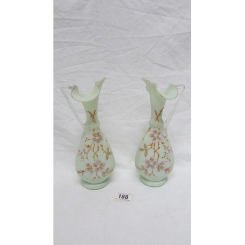 188 - A pair of 19th century hand painted glass ewers