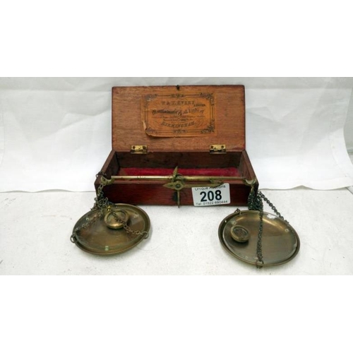 208 - A cased set of Avery brass apothecary scales