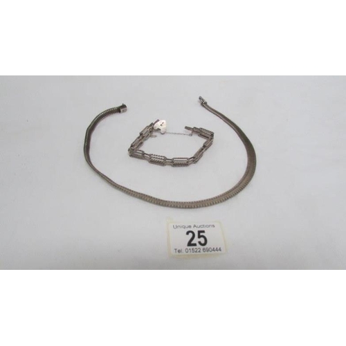 25 - A silver necklace and matching bracelet