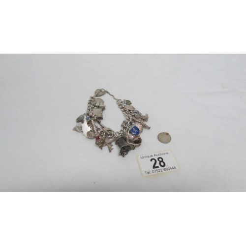 28 - A silver charm bracelet