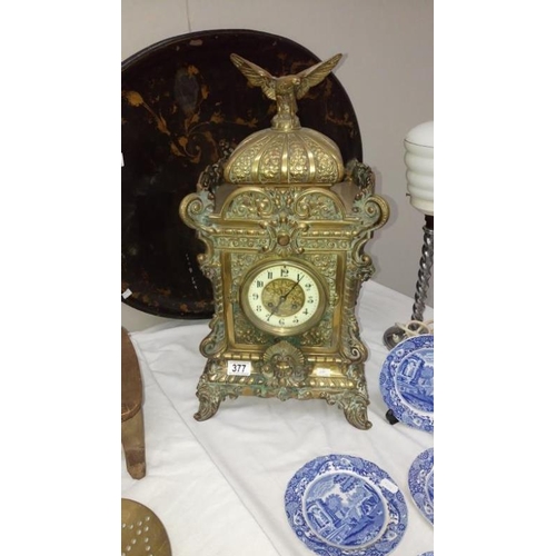 377 - A 24'' brass mantel clock