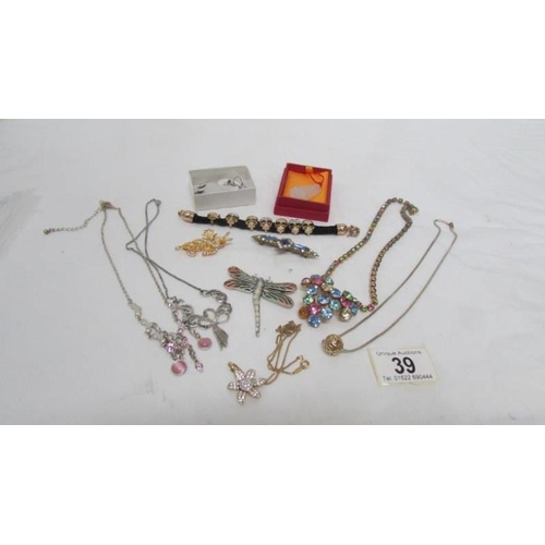 39 - A mixed lot of jewellery including dragon fly brooch, horse earrings, necklaces etc