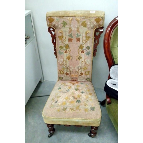 614 - A Victorian mahogany tapestry upholstered nursing chair