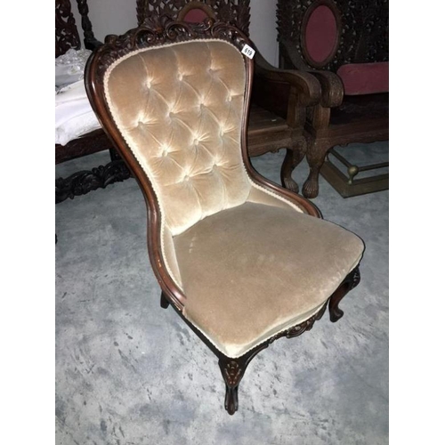 619 - An Edwardian mahogany deep buttoned nursing chair