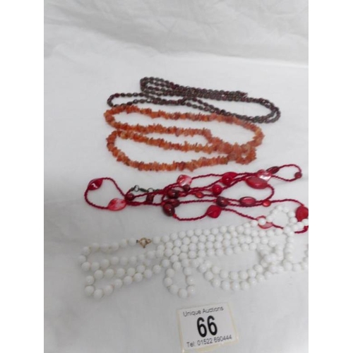 66 - 4 opera length necklaces