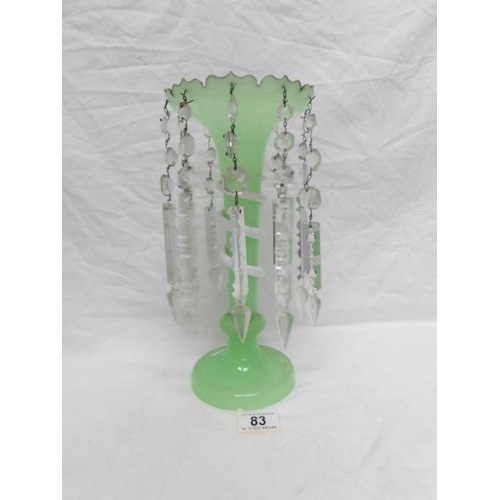 83 - A green glass lustre with crystal droppers