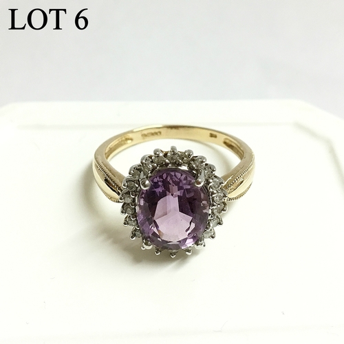 6 - An amethyst and diamond cluster gold set ring, ring size O