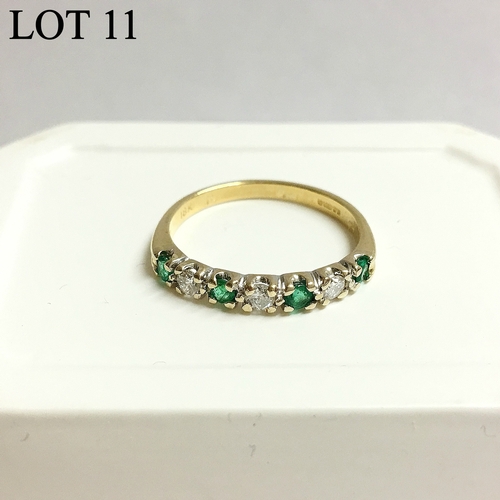 11 - An emerald and diamond band ring set with four emeralds and three diamonds in 18st gold, ring size L