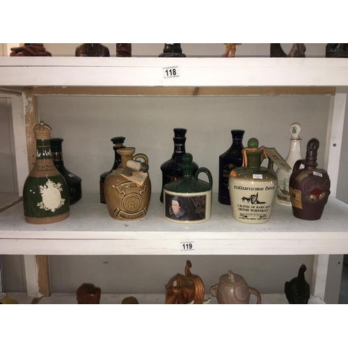 119 - A quantity of ceramic decanters, (some with contents)