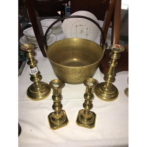 232 - A Victorian brass jam pan & 2 pairs of candlesticks