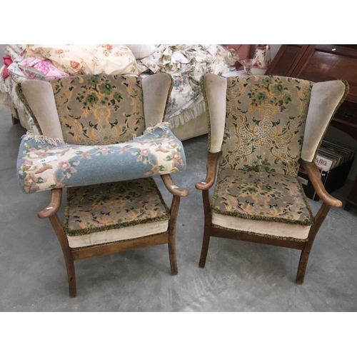 293 - A matching pair of wing armchairs