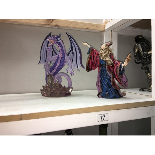 77 - A figure of Merlin & dragon figure