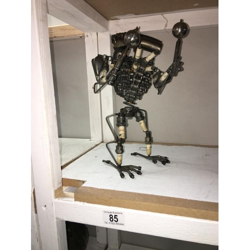 85 - A sculpture of a robot made from motor parts