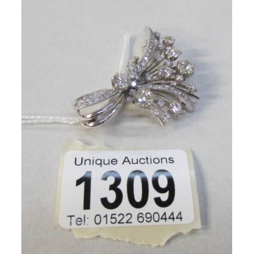 1309 - A superb diamond brooch in the form of a corsage