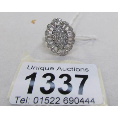 1337 - A 9ct white gold ring set diamonds (one stone missing)