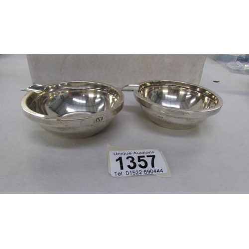 1357 - A pair of silver ash trays marked The Goldsmiths and Silversmiths Company, London hall mark, no date... 