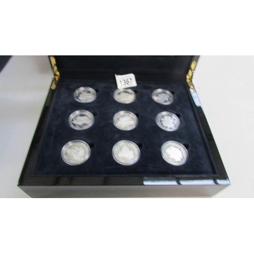 1367 - A cased set of 18 silver crowns, 2009 Royal Mint British Cars collection in original packaging