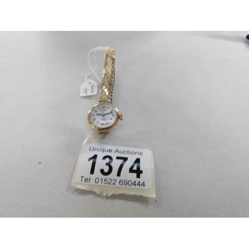 1374 - A Rotary 21 jewel ladies wrist watch on a rolled gold bracelet