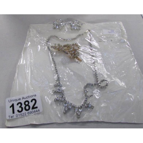 1382 - A vintage diamonte necklace, earrings and brooch