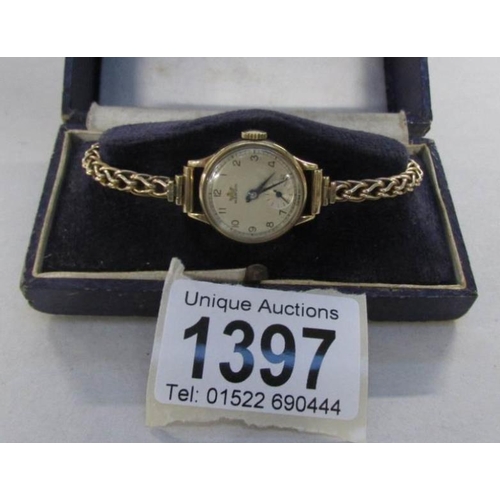 1397 - A Marvin ladies watch with twisted gold strap, all gold cased and in working order, 19.8gms