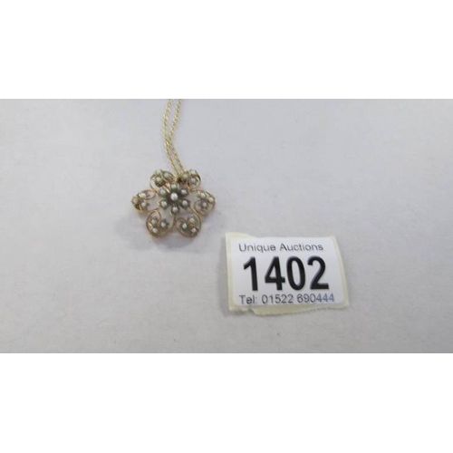 1402 - An Edwardian 9ct gold seed pearl pendant