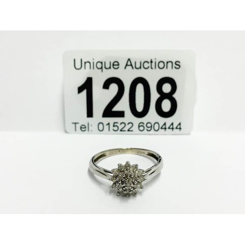 1208 - A 9ct white gold diamond cluster ring, size R