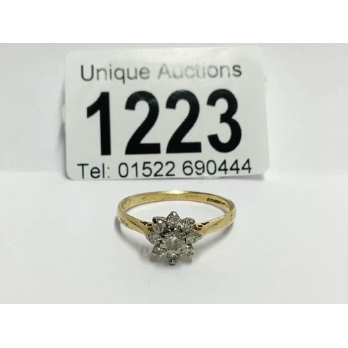 1223 - An 18ct yellow gold floral ring of approximately 60pts of diamonds, size S